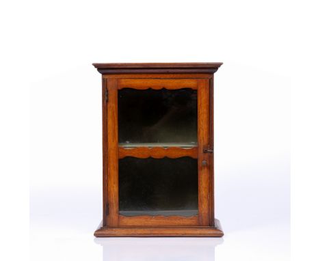 A LATE 19TH CENTURY MAHOGANY SMALL TABLE TOP DISPLAY CABINET, with glazed door enclosing a shelf, 31cm wide