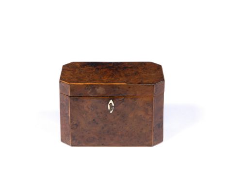 A GEORGE III BURR YEW TEA CADDY of rectangular form with canted corners, hinged lid and twin lidded compartments, 18.5cm wide