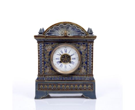 A LATE 19TH CENTURY DOULTON LAMBETH CASED MANTEL CLOCK the convex white enamel dial with blue Roman numerals, Arabic five min