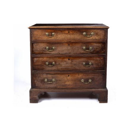 A GEORGE III MAHOGANY CHEST, the top with a moulded edge above four graduated long drawers, ogee bracket feet, 95cm wide