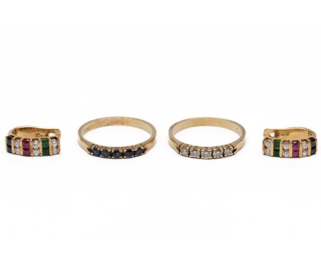 Een paar 14 kt. gouden oorbellen en twee rijringen. De oorbellen gezet met diamant, saffier, robijn en smaragd. Een ring geze