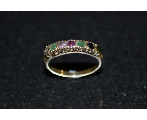 A multi stone gem set regard ring, linear set with various gem stones including ruby, emeralds, sapphires, amethyst, etc, 9ct