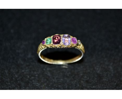 A multi stone gem set regard ring, linear set with various gem stones including ruby, emeralds, sapphires, amethyst, etc, 9ct