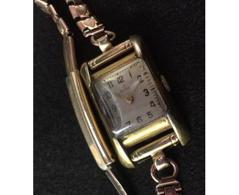 Omega - a lady's wristwatch, square silvered dial, Arabic numerals, minute track, 15 jewel manual wind movement, serial No 11