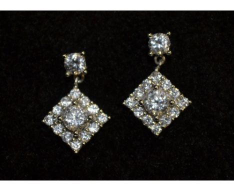 A pair of Art Deco cubic zirconia set diamond shaped drop earrings, white metal studs and pillars, butterflies stamped 9ct, 1