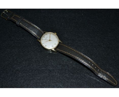 Vertex - a vintage 1950s 9ct gold cased wrist watch, silvered dial, Arabic quartered numerals, arrow batons markers, minute t