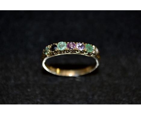 A multi stone gem set regard ring, linear set with various gem stones including ruby, emeralds, sapphires, amethyst, etc, 9ct