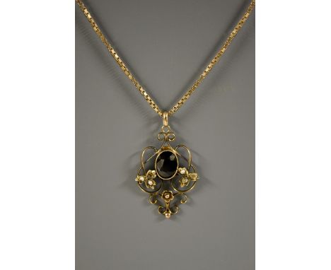 An Art Nouveau garnet and seed pearl pendant necklace, open scrolling pendant with a central oval deep red garnet, two cluste
