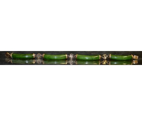 A Chinese jade and 14ct gold panel bracelet, four arched tubular jade links, each mounted with gold end caps, each divided by