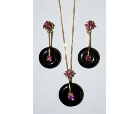 A ruby and black onyx pendant and earring demi parure, the pendant composed of a quartetto cluster of pinky red rubies,  susp