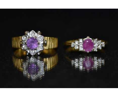 A ruby and diamond cluster ring, central oval pink ruby, flanked to either side by six round cut diamonds, 18ct gold shank, s