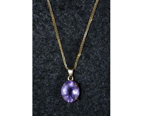 A pale purple amethyst pendant, oval amethyst approx 3.5ct, 9ct quarter claw mount, suspended from a fancy link 9ct gold chai