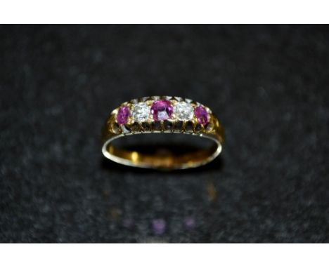 A Victorian five stone diamond and ruby ring, alternate set with three red ruby's and two old cut diamonds, 18ct gold shank, 