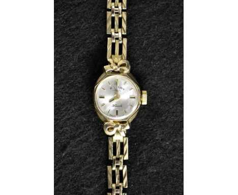 A lady's Rotary 9ct gold wristwatch, silvered dial, baton markers, manual movement, rounded octagonal case, integral 9ct gold