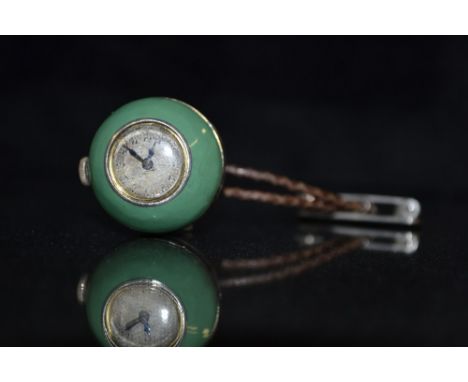 An Art Deco Green and black enamel globular suspension watch, central black band,between green globular side, silvered dial, 