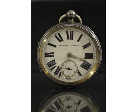 An Edwardian over size silver open face pocket watch,  white dial, bold Roman numerals, minute track, subsidiary seconds, sil