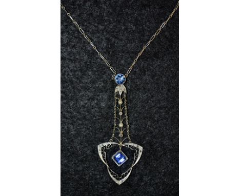 An Art Deco sapphire, diamond and seed pearl arrow pendant necklace, fine open worn arrow pendant set with two blue sapphires