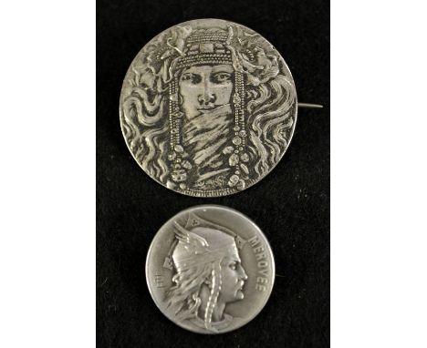 Louis Rault (1847-1902) - a French Art Nouveau silver coloured metal brooch, Helmeted Warrior, titled Merovee, signed with LR