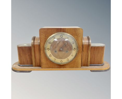 An early 20th century walnut Art Deco style mantel clock.