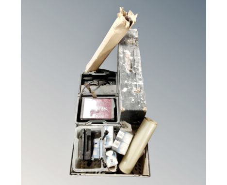 A toolbox together with various tools, boxes of lightbulbs, thermal arc etc.