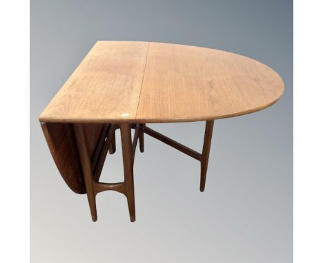 A mid-20th century teak gate leg table.