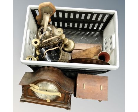 A crate containing antique and later metal wares including candlesticks, an oil lamp base, Edwardian oak cased mantel clock, 