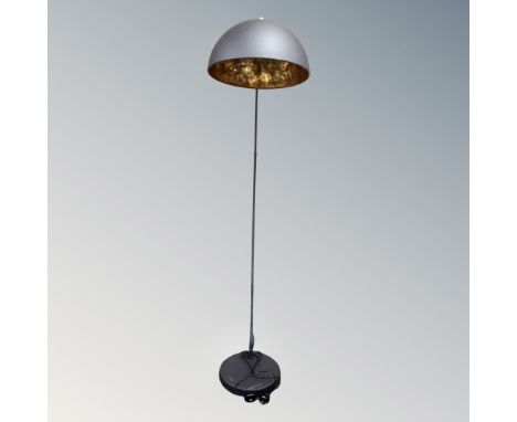 A contemporary over chair floor lamp.