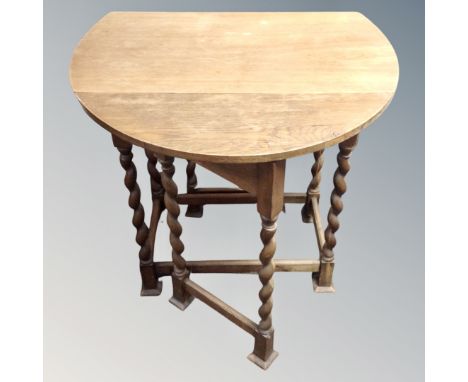 A 20th century flap sided gate leg table.