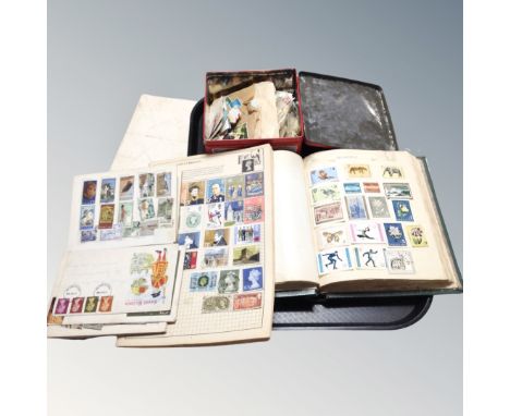 A stamp album including first day cover and a quantity of loose stamps.