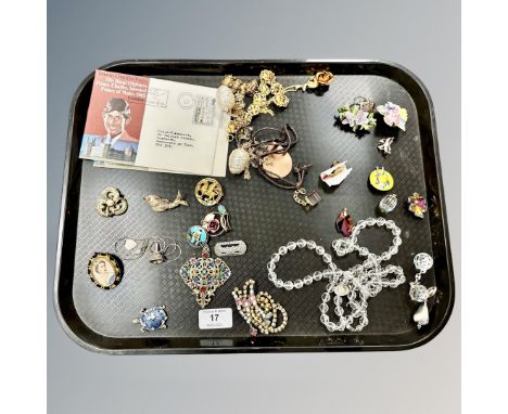 A collection of costume jewellery, Queen Elizabeth II brooch and two Prince Charles first day covers. (Q)