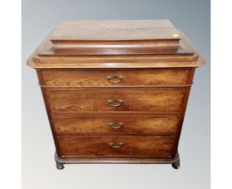 A 19th century Scandinvian four drawer chest on scroll feet with caddy top