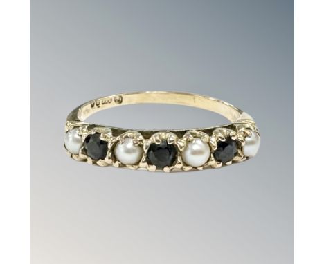 A 9ct yellow gold sapphire and seed pearl dress ring, size N/O, 1.8g.