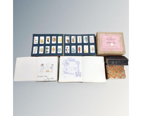 A tray containing a cigarette card album, autograph book, trinket box, dominoes etc.