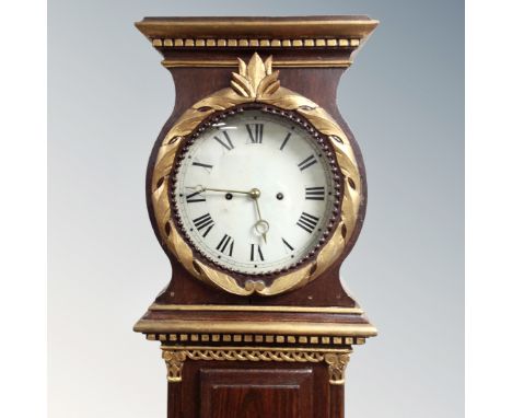 A Scandinavian painted longcase clock with circular dial, pendulum and weights.