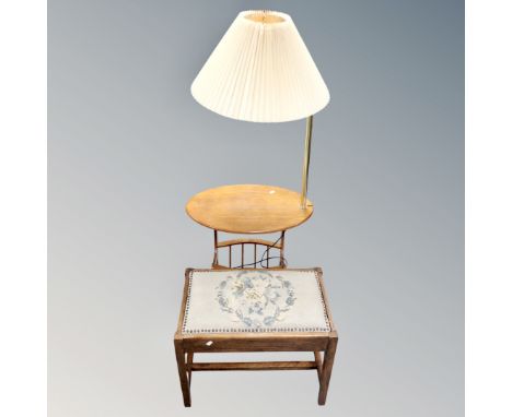 An early 20th century oak tapestry upholstered dressing table stool together with a contemporary magazine table fitted with l