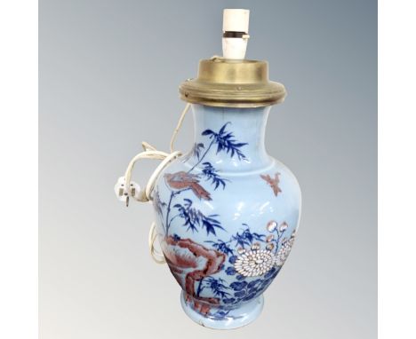 A Chinese blue glazed porcelain vase converted to a table lamp.