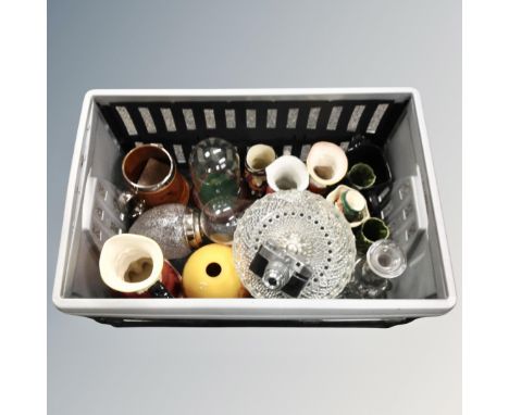 A crate containing assorted ceramics and glassware including Toby jugs by Royal Doulton and Burleigh ware, tankards, glass do