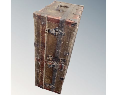 A vintage canvas and metal bound trunk.