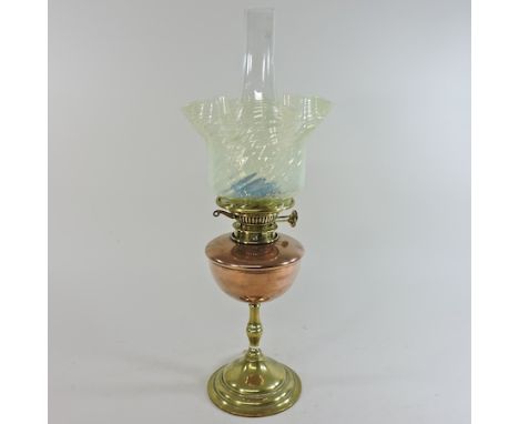 An early 20th century copper and brass oil lamp, by W A S Benson, RD182984, stamped BENSON to base, with a green vaseline gla