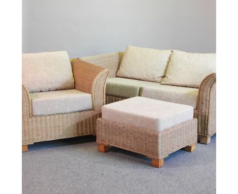 A wicker sofa, 177cm, together with a matching armchair and footstool