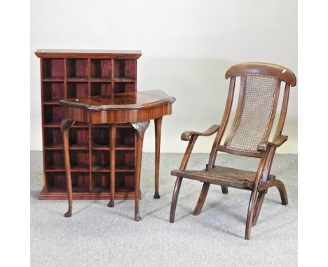 A hardwood bookcase, 69cm, together with an early 20th century folding deck chair and a mahogany folding card table (3)