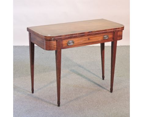 A 19th century mahogany D shaped card table, on square tapered legs, 99cm, together with a wrought iron adjustable oil lamp (