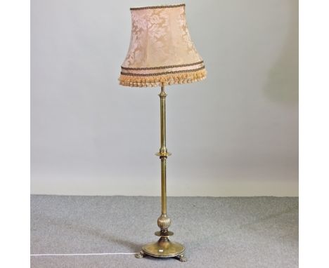 A 19th century brass telescopic standard lamp and shade