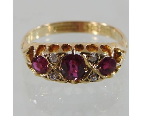 An 18 carat gold ruby and diamond ring, boxed