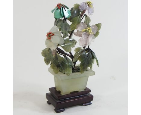 A jade coloured carving of a tree, 15cm high