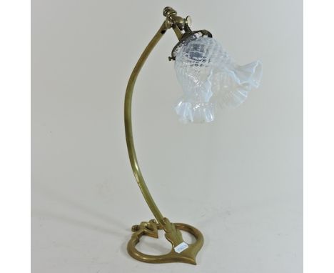 An Arts and Crafts brass desk lamp, of stylised form, in the manner of Benson, stamped AD 699, with a frilled glass shade, 39