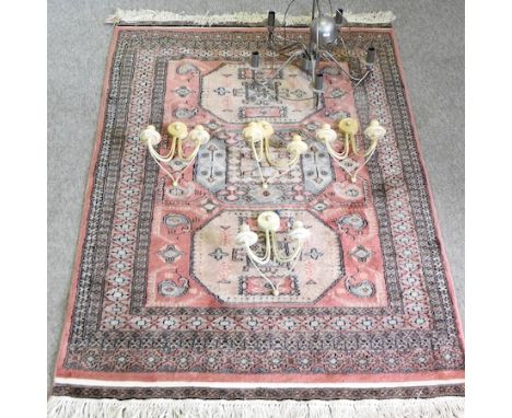 A pair of brass curtain poles, together with another larger, painted wall lights, a metal ceiling light and a rug