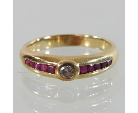 An 18 carat gold ruby and diamond ring, boxed