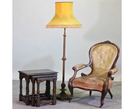 A Victorian mahogany and green upholstered armchair, together with a nest of three oak occasional tables, largest 53cm, and a