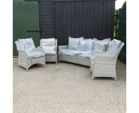 A grey rattan three seater sofa, 182cm, together with three armchairs, with loose cushions